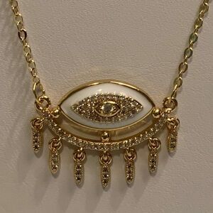 New, no tags, evil eye charm and chain, clear stones and white enamel accents